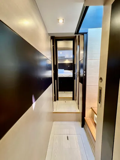  Yacht Photos Pics Interior hallway of 2022 OKEAN Flybridge 50 yacht, leading to a bedroom.