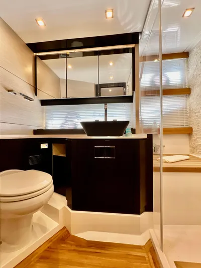  Yacht Photos Pics Luxurious bathroom in 2022 OKEAN Flybridge 50 yacht with modern fixtures and elegant design.