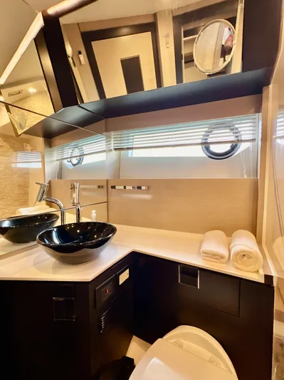  Yacht Photos Pics Modern bathroom on 2022 OKEAN Flybridge 50 yacht with sleek black sink.
