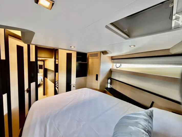  Yacht Photos Pics Luxurious bedroom interior of 2022 OKEAN Flybridge 50 yacht with modern design.