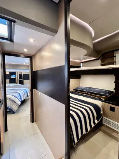  Yacht Photos Pics 2022 OKEAN Flybridge 50 yacht interior with modern bedroom and bunk beds.