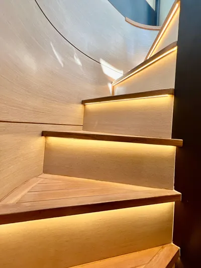  Yacht Photos Pics Modern staircase with ambient lighting on the 2022 OKEAN Flybridge 50 yacht.