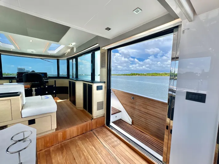  Yacht Photos Pics Interior of 2022 OKEAN Flybridge 50 yacht with open sliding door and scenic water view.