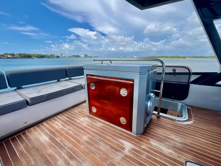 Yacht Photos Pics 2022 OKEAN Flybridge 50 yacht deck with seating and storage, overlooking serene waters.