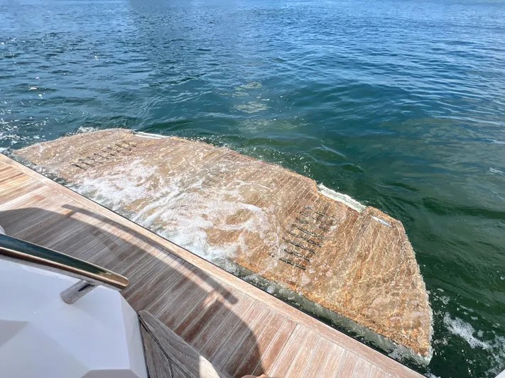  Yacht Photos Pics OKEAN Flybridge 50 2022 yacht's swim platform in water.