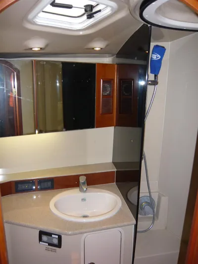 Bobalu Yacht Photos Pics 2004 Rampage 38 Express yacht bathroom with sink, mirror, and shower.