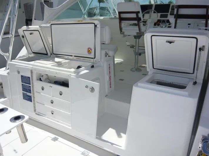 Bobalu Yacht Photos Pics 2004 Rampage 38 Express boat interior with open storage compartments and seating.