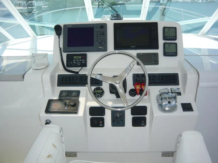 Bobalu Yacht Photos Pics Control panel of 2004 Rampage 38 Express boat with navigation and communication equipment.