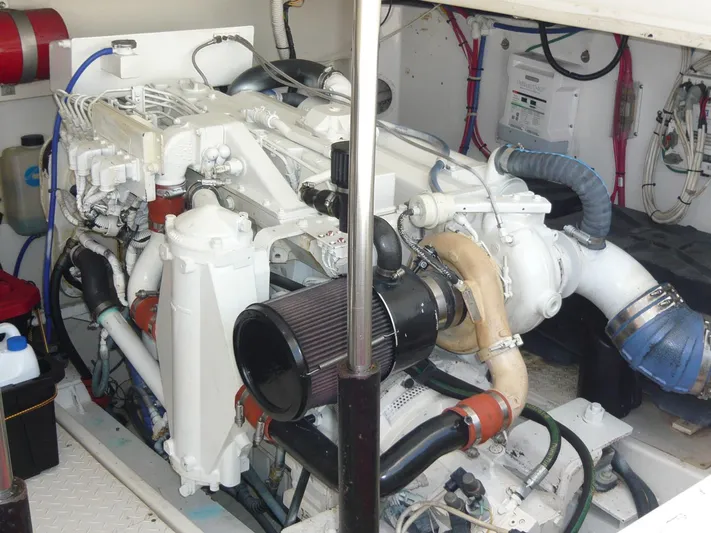 Bobalu Yacht Photos Pics Engine room of a 2004 Rampage 38 Express boat, showcasing detailed mechanical components.
