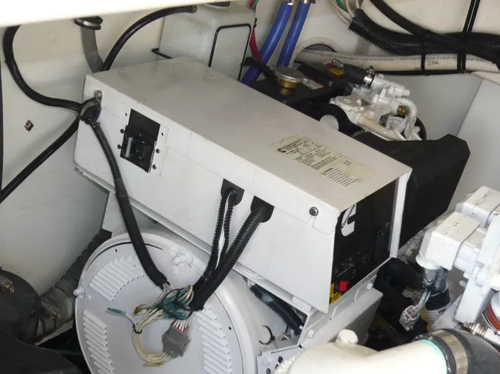 Bobalu Yacht Photos Pics Engine room of 2004 Rampage 38 Express boat, featuring mechanical components and wiring.