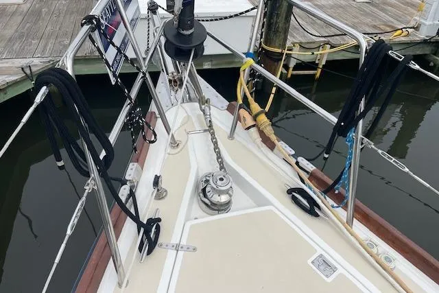 Alegria Yacht Photos Pics Bow of 2007 Tartan 4400 sailboat with anchor chain and docked at marina.