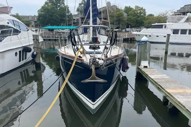 Alegria Yacht Photos Pics Sailboat Tartan 4400, 2007 model, docked at marina with surrounding yachts.