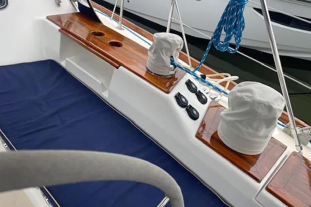 Alegria Yacht Photos Pics Tartan 4400 sailboat deck, 2007 model, featuring wooden accents and covered winches.