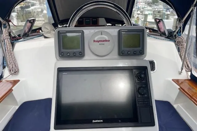 Alegria Yacht Photos Pics Cockpit of 2007 Tartan 4400 sailboat with Garmin and Raymarine navigation systems.