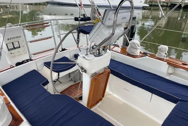 Alegria Yacht Photos Pics 2007 Tartan 4400 sailboat cockpit with blue seating and steering wheel.