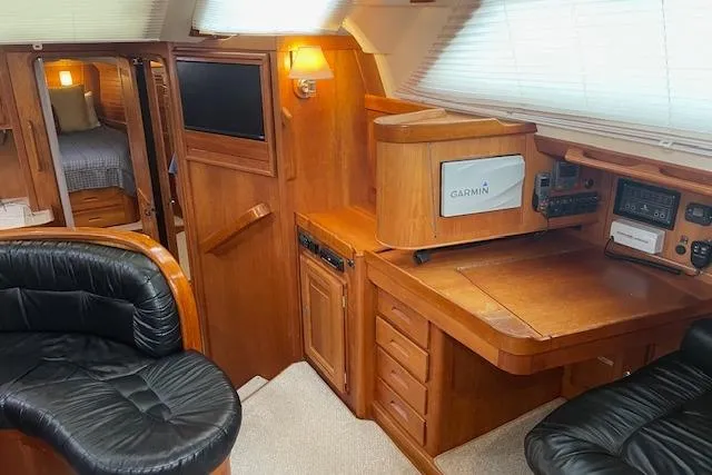 Alegria Yacht Photos Pics Luxurious 2007 Tartan 4400 yacht interior with wood finish and modern navigation equipment.