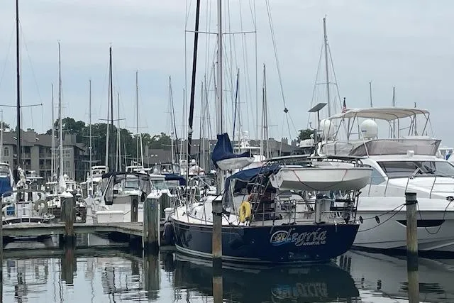 Alegria Yacht Photos Pics Sailboats docked at a marina, featuring a 2007 Tartan 4400 model.