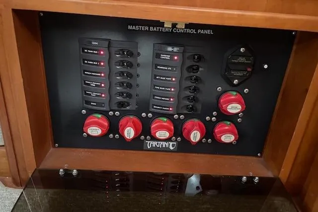 Alegria Yacht Photos Pics Master battery control panel of 2007 Tartan 4400 yacht with switches and dials.
