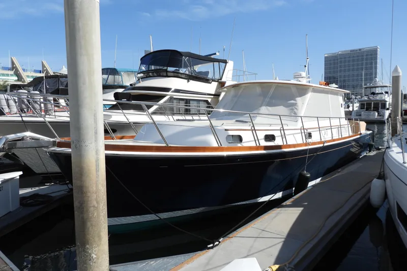  Yacht Photos Pics 2015 Grand Banks 46 Eastbay SX yacht docked at marina under clear blue sky.