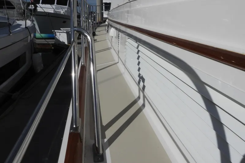  Yacht Photos Pics 2015 Grand Banks 46 Eastbay SX yacht deck with polished railings and sleek design.