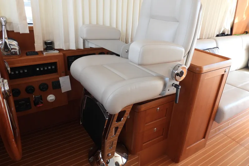  Yacht Photos Pics Luxury helm seat in 2015 Grand Banks 46 Eastbay SX yacht interior.