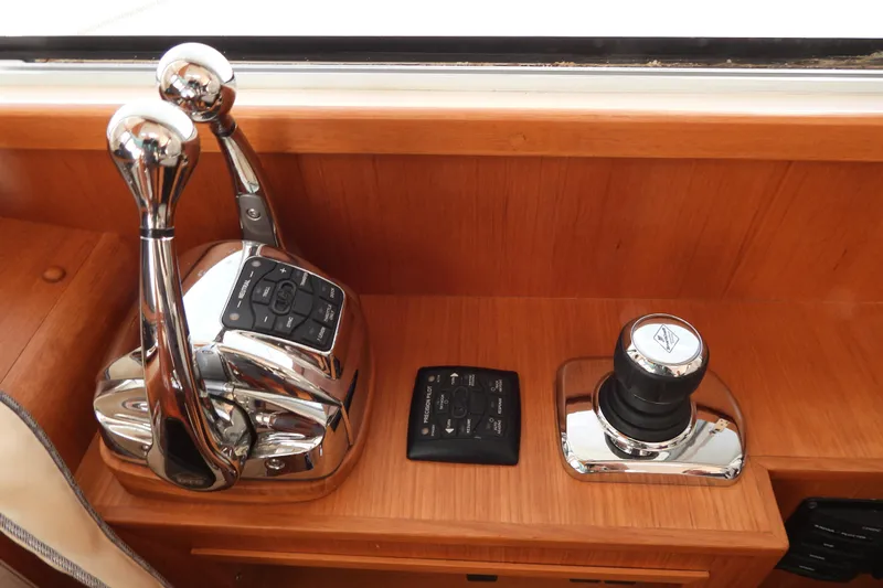  Yacht Photos Pics Control panel of 2015 Grand Banks 46 Eastbay SX yacht with throttle and joystick.