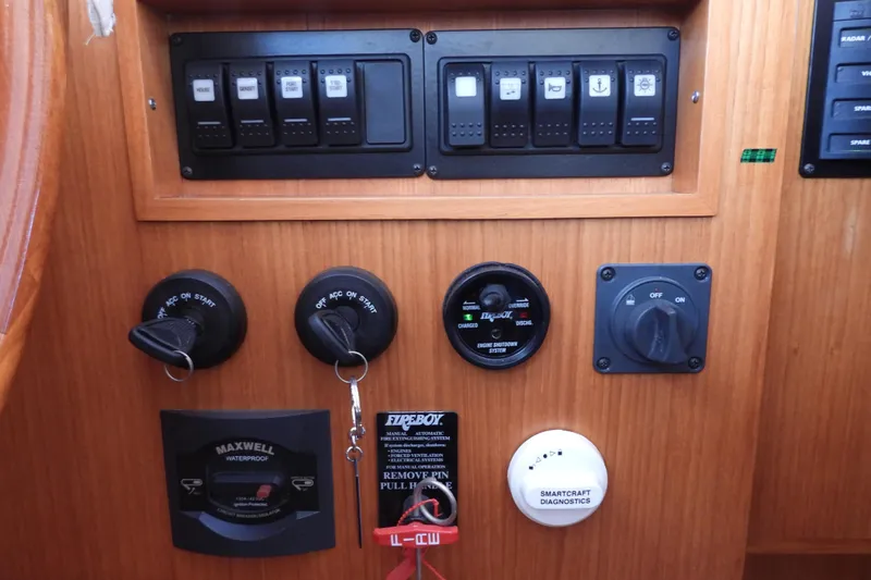  Yacht Photos Pics Control panel of 2015 Grand Banks 46 Eastbay SX yacht with switches and ignition keys.