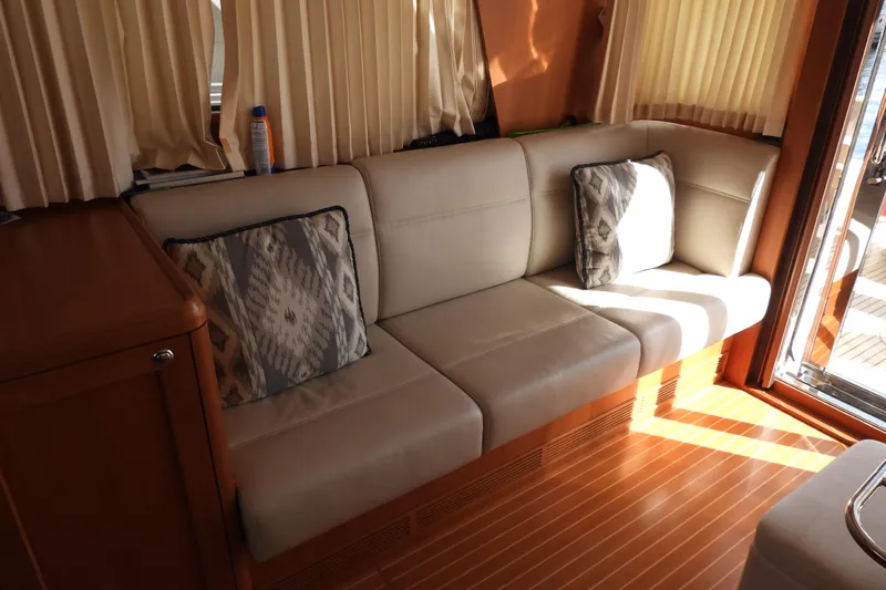  Yacht Photos Pics Luxurious interior of 2015 Grand Banks 46 Eastbay SX with elegant seating and cushions.