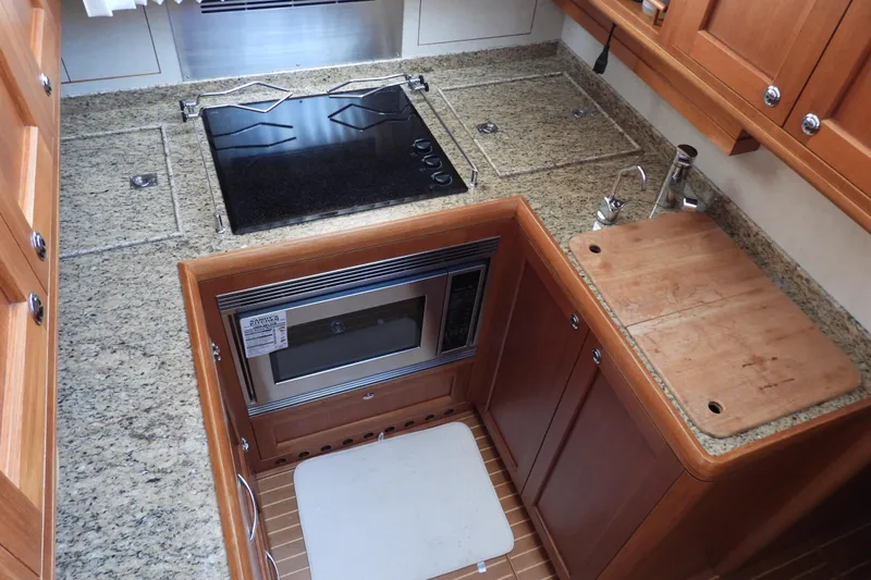  Yacht Photos Pics Luxurious galley kitchen in 2015 Grand Banks 46 Eastbay SX yacht with granite countertops.