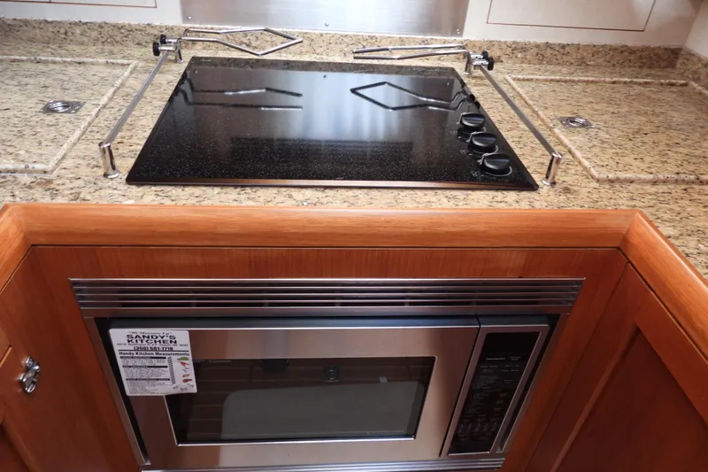  Yacht Photos Pics Luxury yacht kitchen with granite countertops and modern appliances, Grand Banks 46 Eastbay SX 2015.