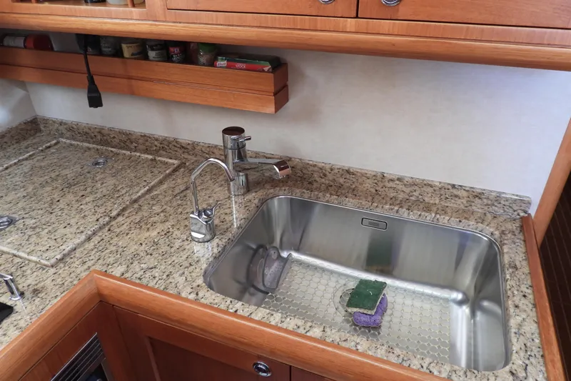  Yacht Photos Pics Granite countertop and sink in 2015 Grand Banks 46 Eastbay SX yacht kitchen.