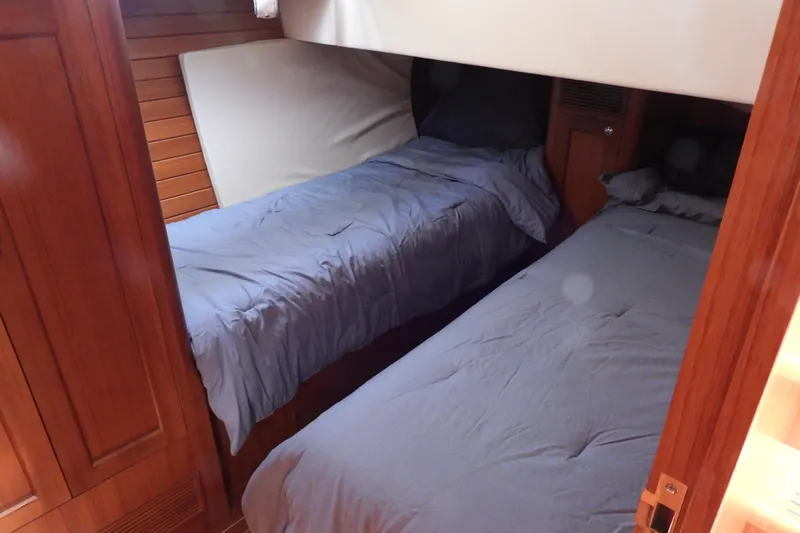  Yacht Photos Pics Twin cabin with wooden interior on 2015 Grand Banks 46 Eastbay SX yacht.