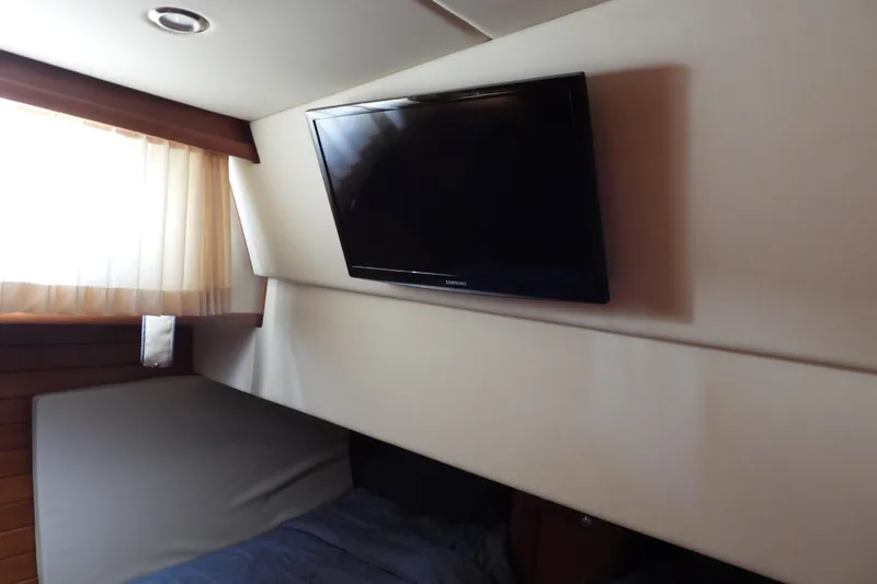  Yacht Photos Pics Interior of 2015 Grand Banks 46 Eastbay SX with wall-mounted TV and window.