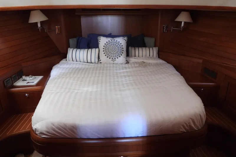  Yacht Photos Pics Luxurious cabin interior of 2015 Grand Banks 46 Eastbay SX yacht with cozy bed.