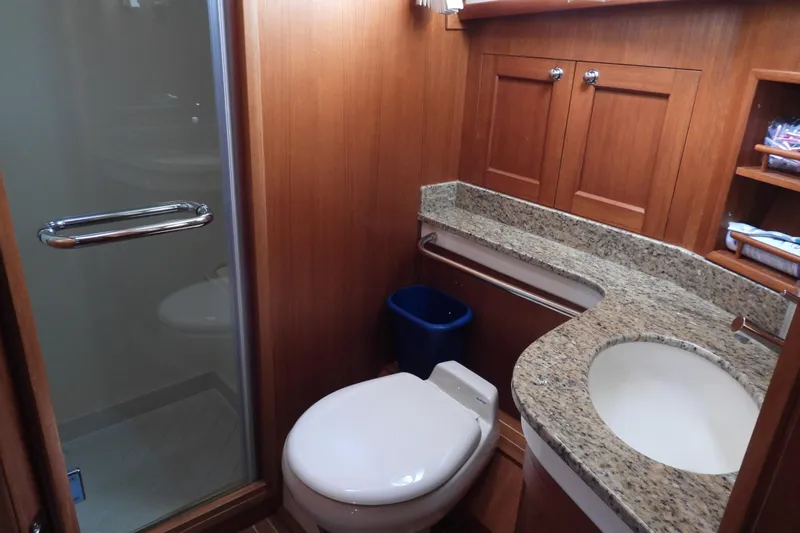  Yacht Photos Pics Luxurious bathroom in 2015 Grand Banks 46 Eastbay SX yacht with granite countertop and shower.