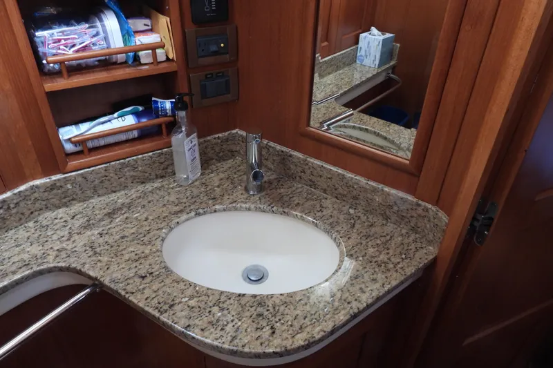  Yacht Photos Pics Granite countertop and sink in 2015 Grand Banks 46 Eastbay SX yacht bathroom.