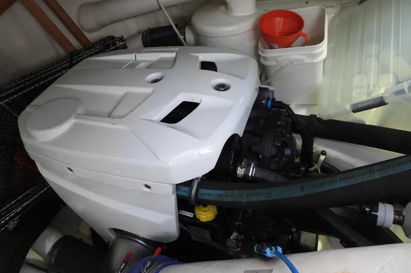  Yacht Photos Pics Engine compartment of 2015 Grand Banks 46 Eastbay SX with marine equipment and hoses.