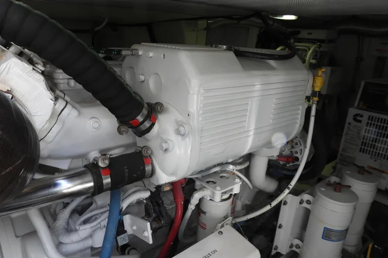  Yacht Photos Pics Engine room of 2015 Grand Banks 46 Eastbay SX, showcasing mechanical components and systems.