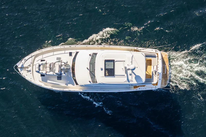 True North Yacht Photos Pics Aerial view of 2020 Maritimo 59 Motoryacht cruising on open water.