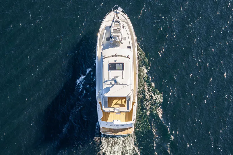 True North Yacht Photos Pics Aerial view of 2020 Maritimo 59 Motoryacht cruising on open water.