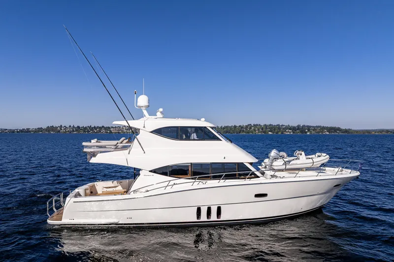 True North Yacht Photos Pics 2020 Maritimo 59 Motoryacht cruising on a clear blue sea under a sunny sky.