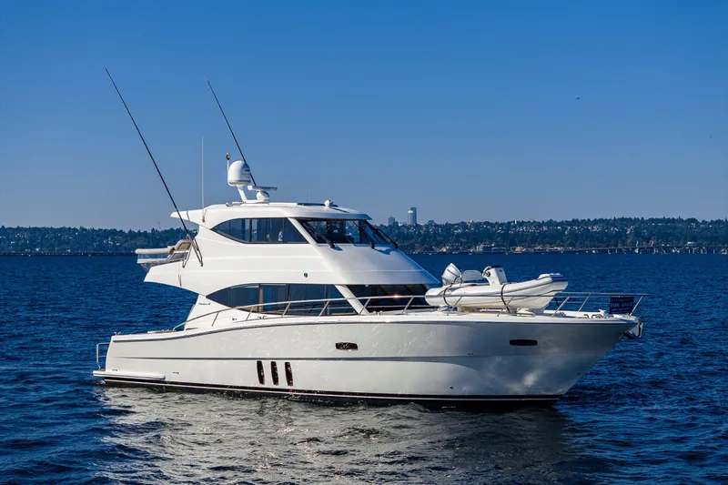 True North Yacht Photos Pics 2020 Maritimo 59 Motoryacht cruising on open water under clear blue sky.