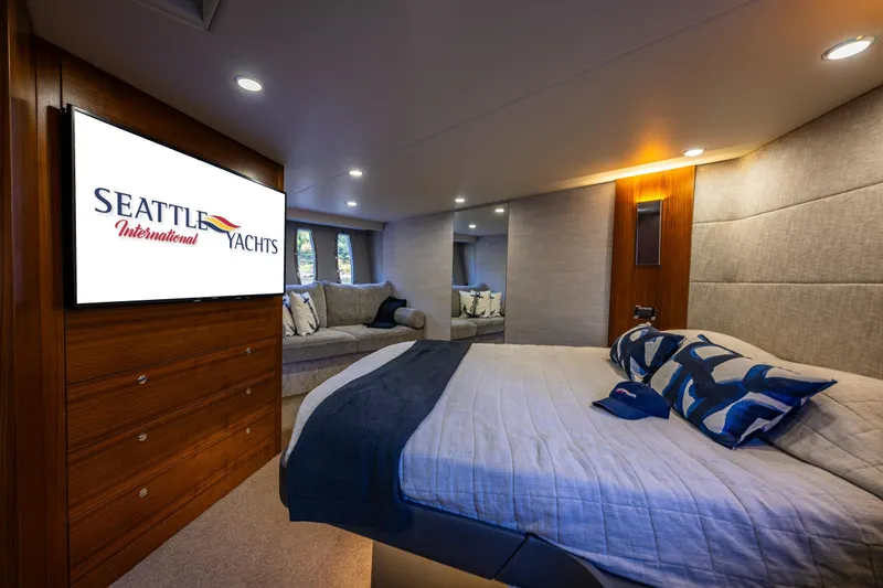 True North Yacht Photos Pics Luxurious interior of 2020 Maritimo 59 Motoryacht with cozy bed and seating area.