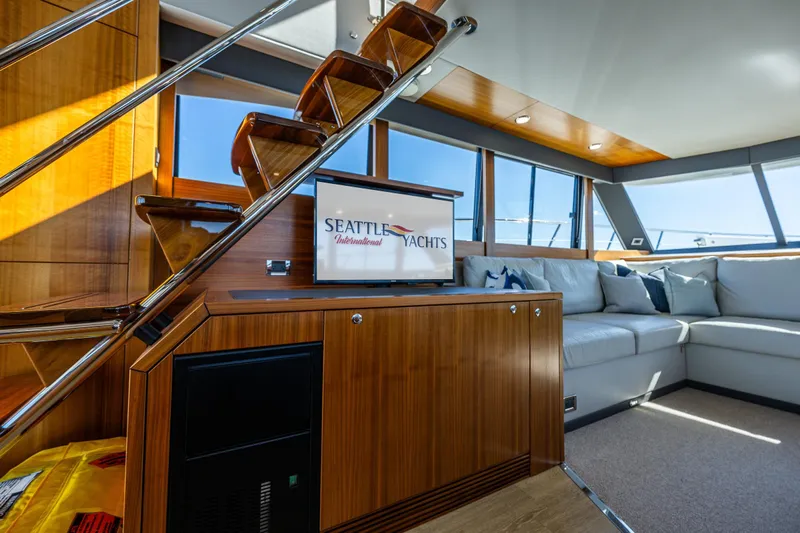 True North Yacht Photos Pics Luxurious interior of 2020 Maritimo 59 Motoryacht with elegant wood finishes and plush seating.