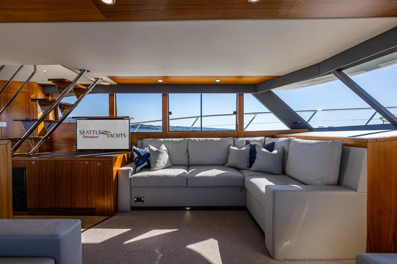 True North Yacht Photos Pics Luxurious interior of 2020 Maritimo 59 Motoryacht with plush seating and panoramic windows.