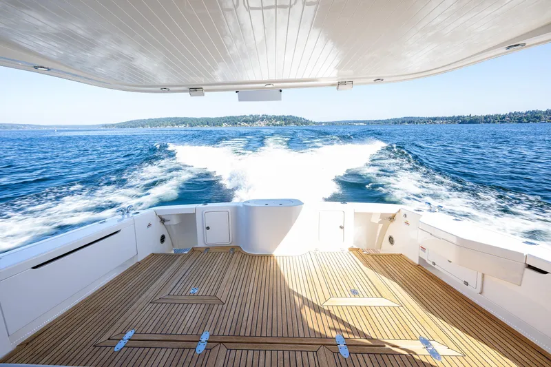 True North Yacht Photos Pics 2020 Maritimo 59 Motoryacht cruising on open water, view from deck.