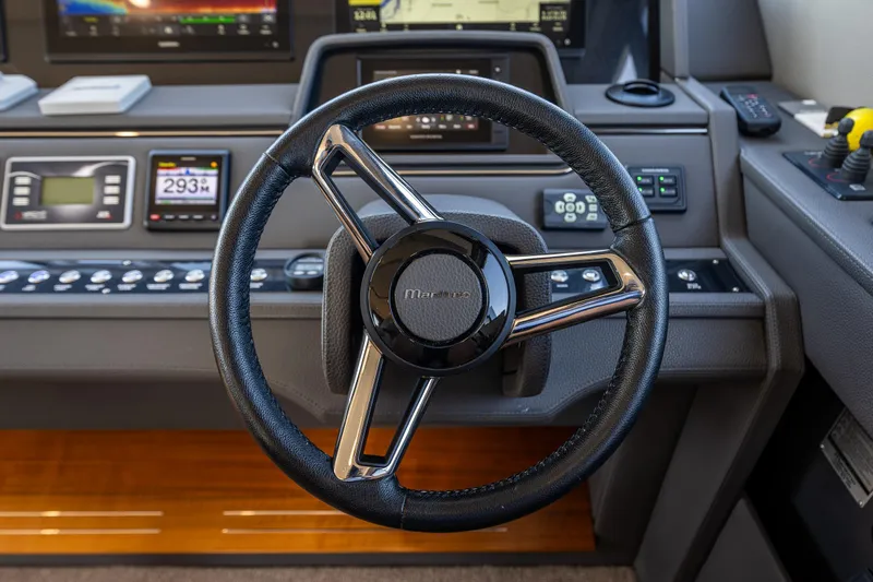 True North Yacht Photos Pics Steering wheel of 2020 Maritimo 59 Motoryacht with control panel and navigation displays.
