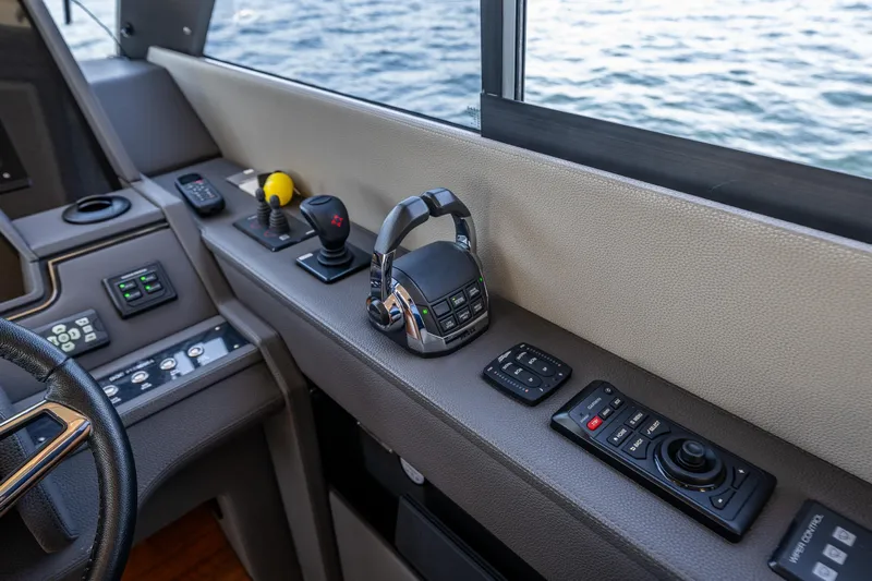 True North Yacht Photos Pics Control panel of 2020 Maritimo 59 Motoryacht with ocean view through window.