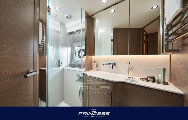  Yacht Photos Pics Luxurious bathroom interior of 2024 Princess V55 yacht with modern fixtures and elegant design.