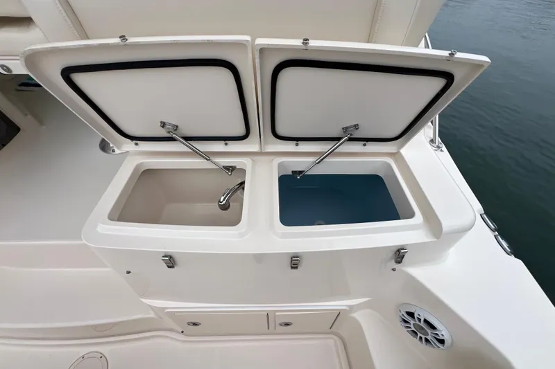 Be Chumming Yacht Photos Pics 2018 Grady-White Express 370 boat with open storage compartments and water view.